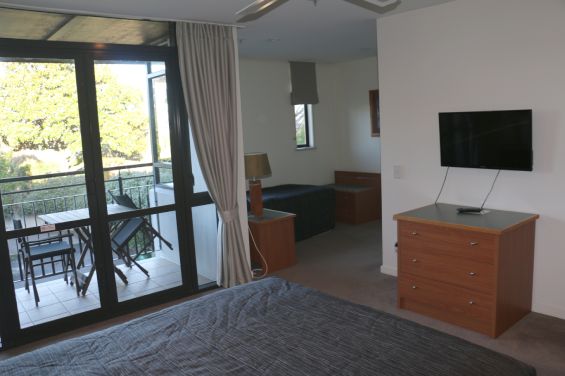 Executive Suite bedroom with TV