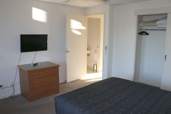 Executive Suite bedroom with TV